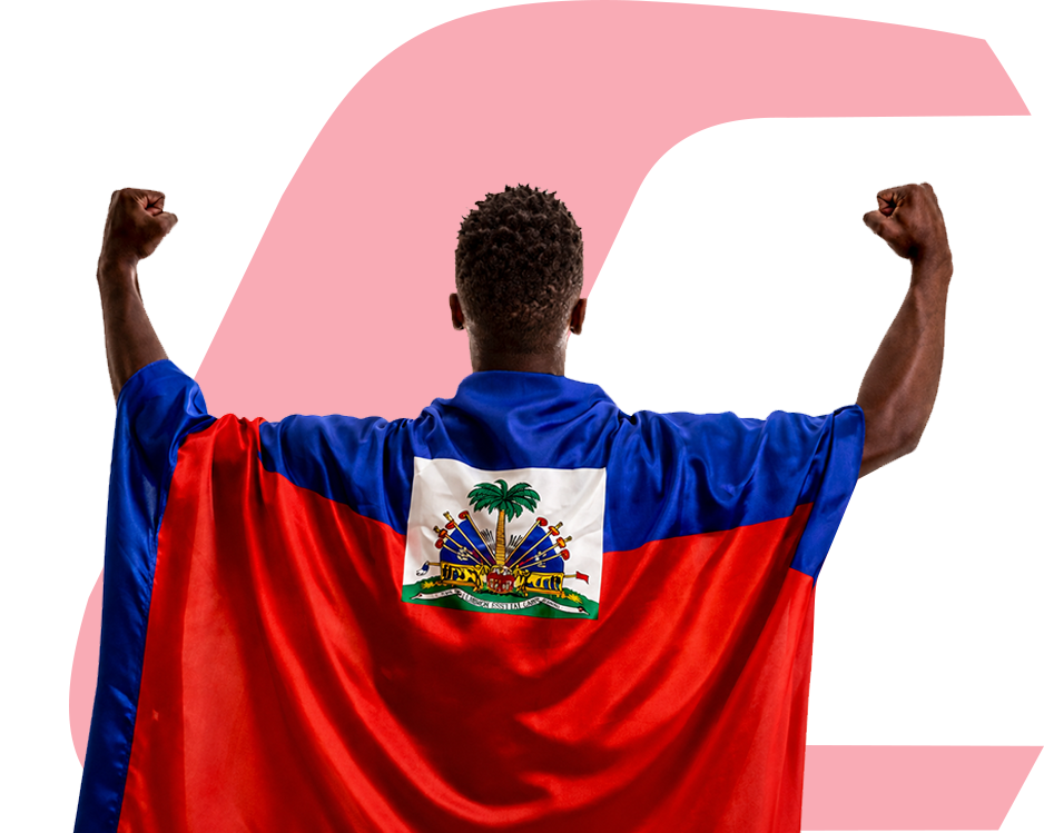 Homme portant fièrement le drapeau d'Haïti sur son dos, avec un mouvement de victoire. Il est devant le logo de Capital Bank.