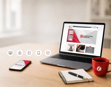 Laptop et téléphone portable avec les écrans de Capital Bank Online
